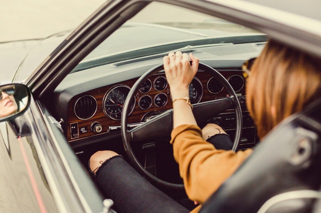 woman riding on black vehicle 374137